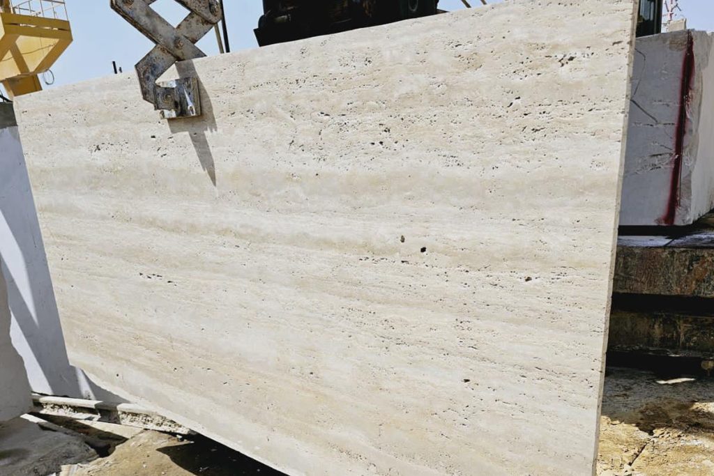 Travertine slabs being processed and polished in factory