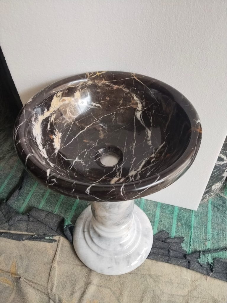 Black and gold marble vessel sink natural stone detail